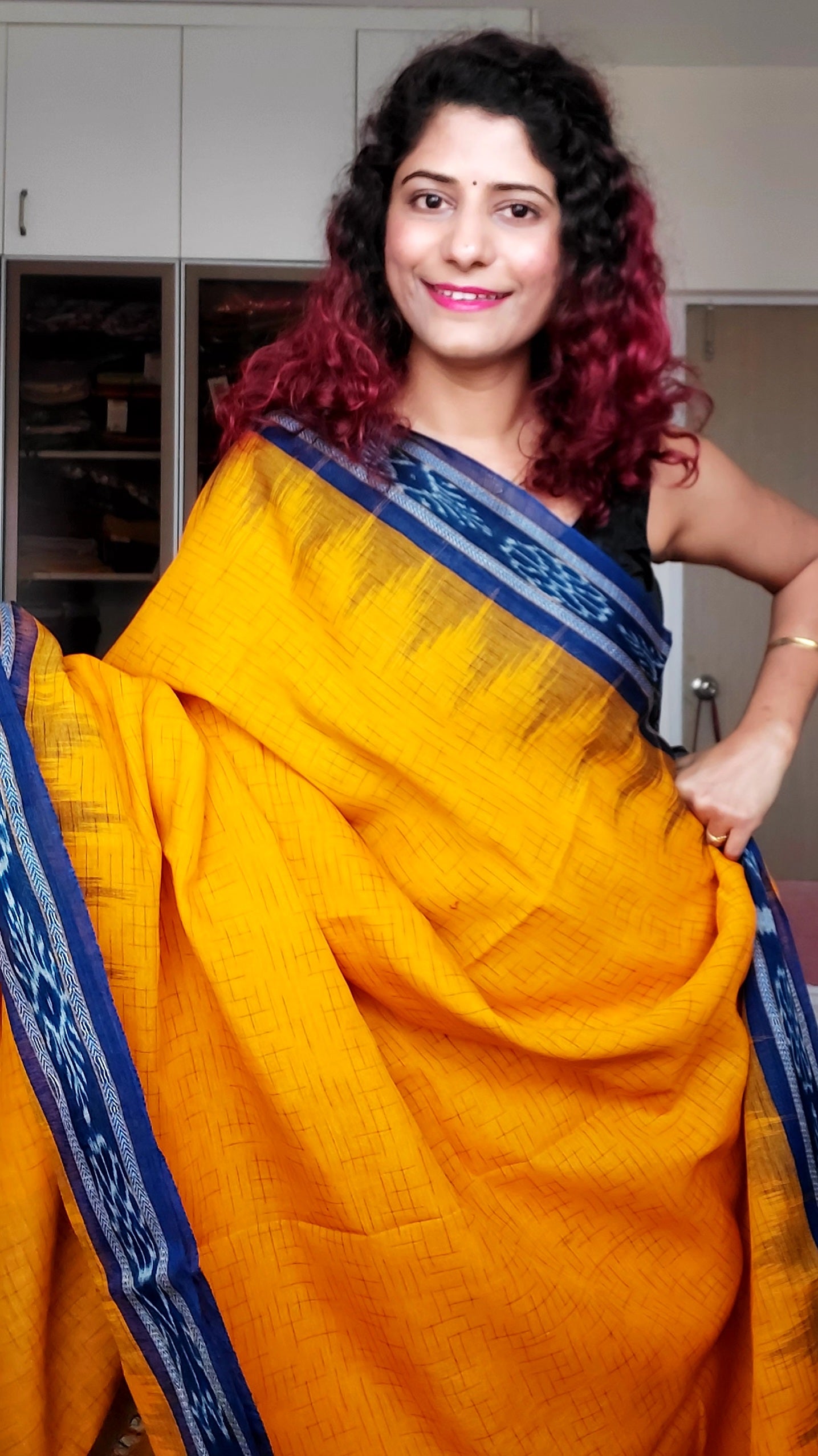 Bandha pere pere sambalpuri pata saree in Yellow and red colour.